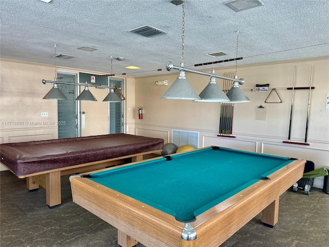 recreation room with a textured ceiling and billiards