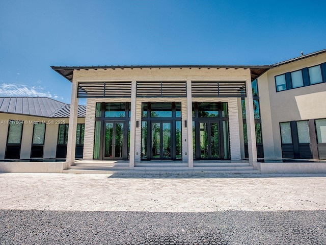 entrance to property featuring french doors