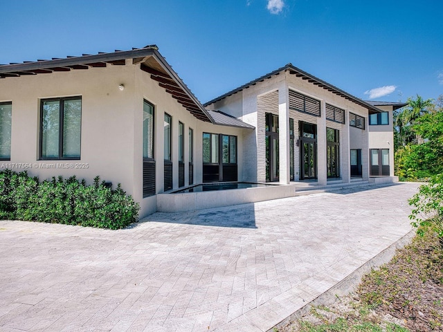 rear view of property with a patio