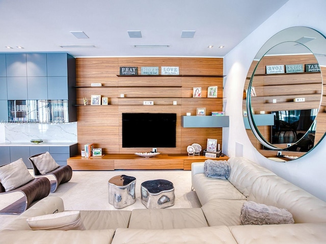 living room featuring wood walls