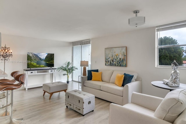 living room with light hardwood / wood-style flooring