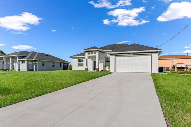 view of front of home with a garage and a front lawn