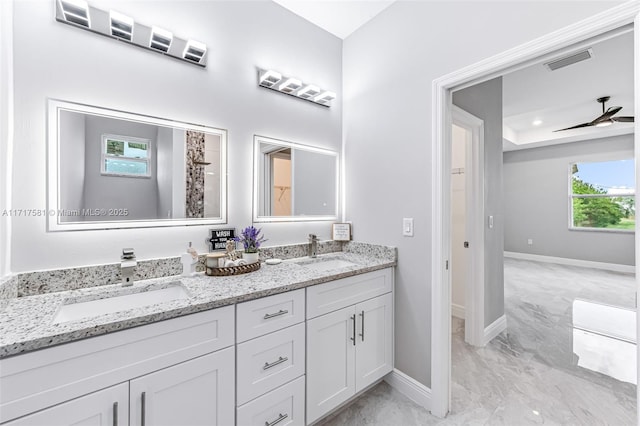 bathroom featuring ceiling fan and vanity