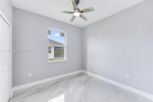 unfurnished room with ceiling fan