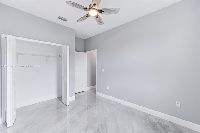 unfurnished bedroom featuring a closet and ceiling fan