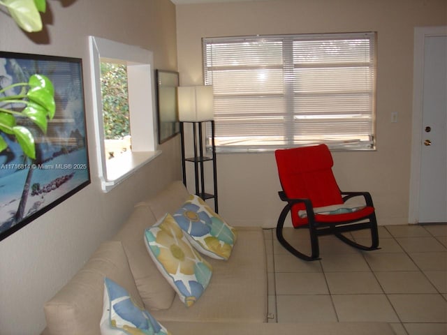 living area featuring light tile patterned floors and a wealth of natural light