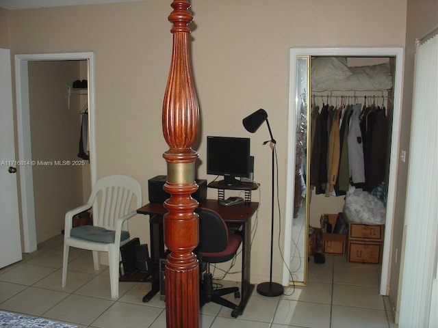 tiled bedroom featuring a closet