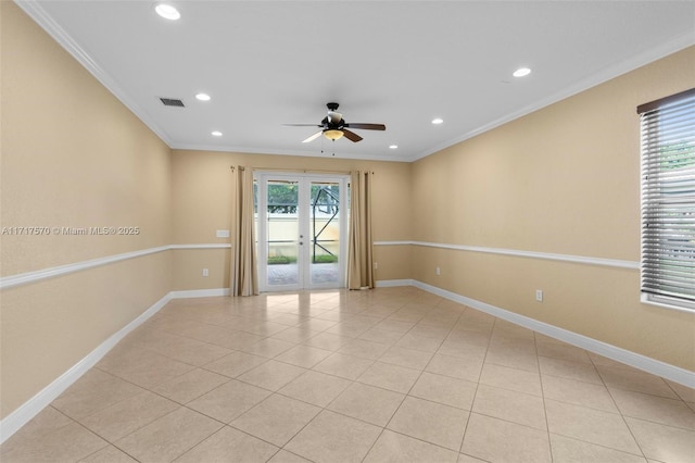 tiled empty room with ceiling fan and ornamental molding