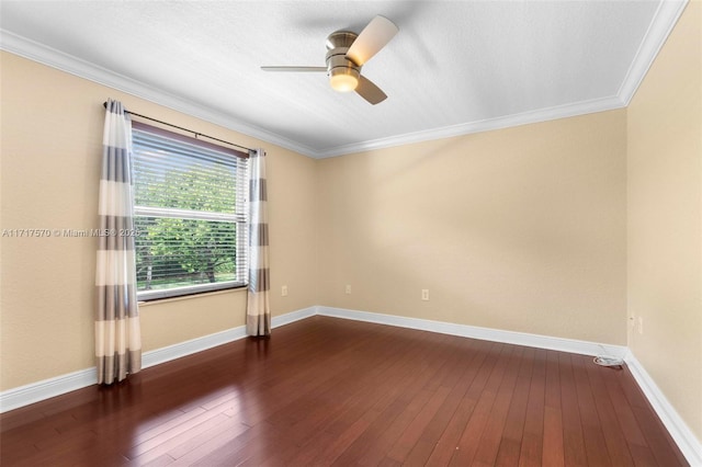 unfurnished room featuring dark wood-type flooring, ceiling fan, and crown molding