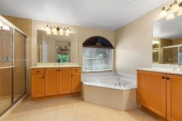 bathroom featuring separate shower and tub, tile patterned flooring, and vanity