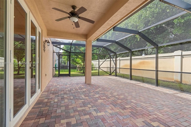 exterior space featuring a lanai and ceiling fan