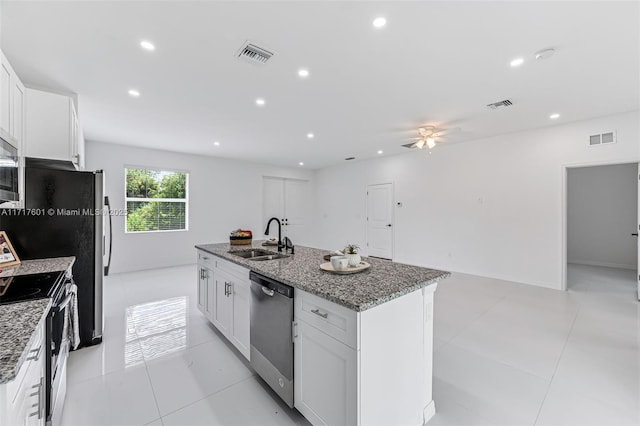 kitchen with white cabinets, sink, a kitchen island with sink, and stainless steel appliances