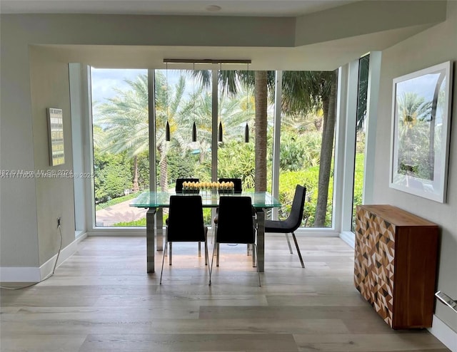 sunroom / solarium featuring a healthy amount of sunlight