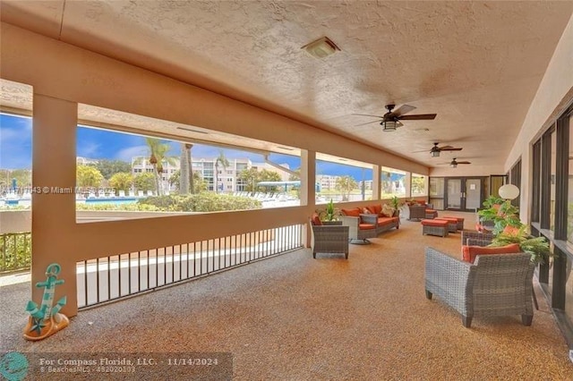 view of patio / terrace with ceiling fan and an outdoor hangout area