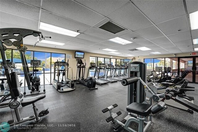 exercise room featuring a paneled ceiling