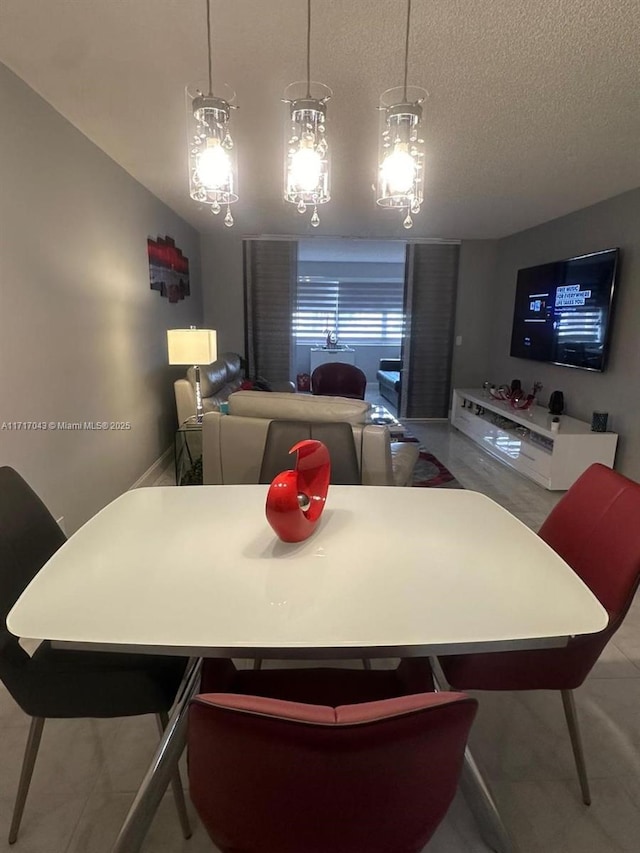 dining space with a textured ceiling