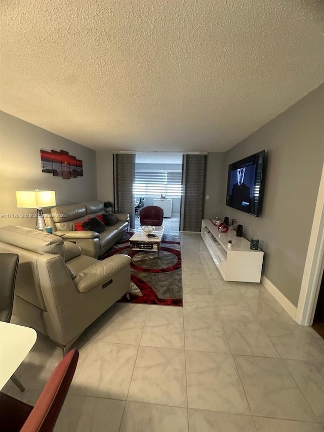 tiled living room with a textured ceiling