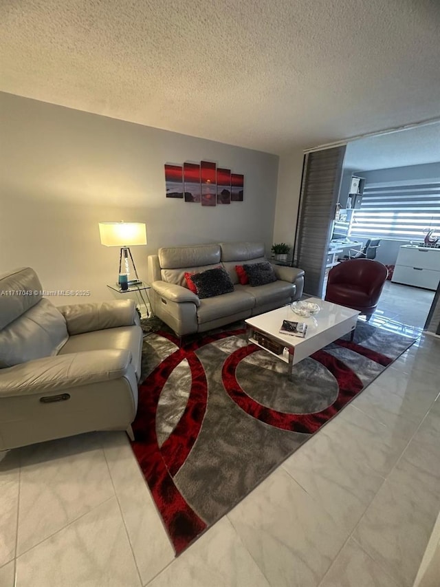 living room with a textured ceiling