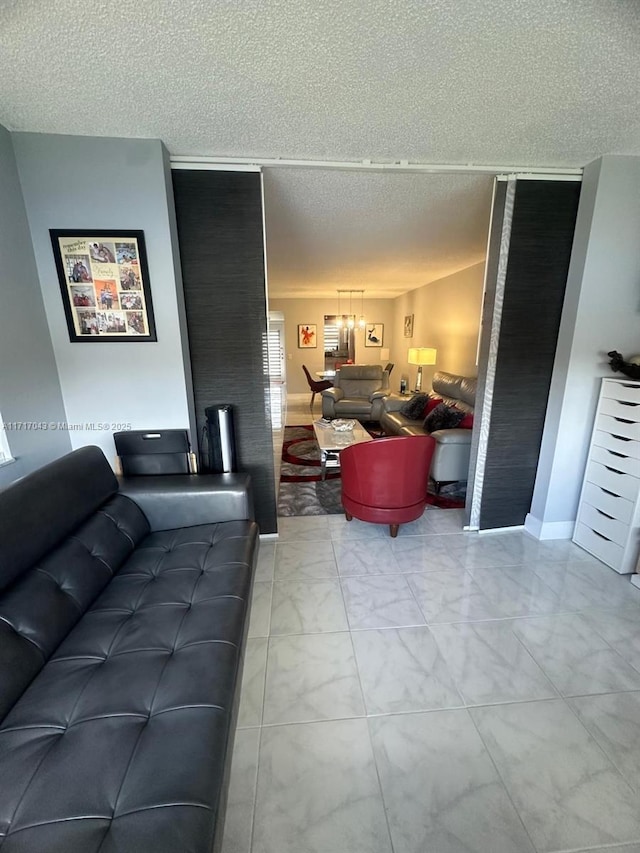 living room with a textured ceiling