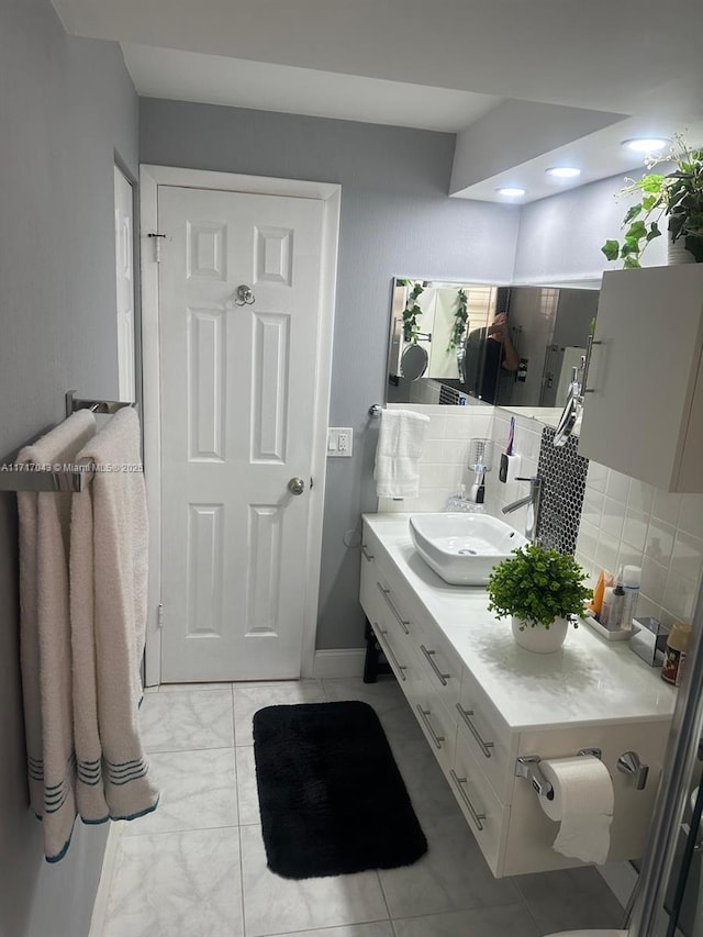 bathroom featuring decorative backsplash and vanity