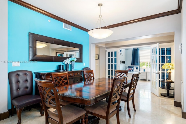 dining space featuring french doors and ornamental molding