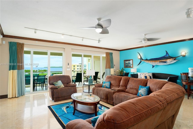 living room with a wealth of natural light, ceiling fan, and ornamental molding