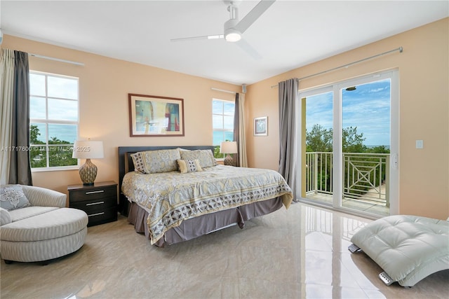 bedroom featuring ceiling fan and access to exterior