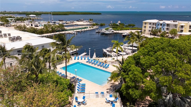 birds eye view of property with a water view