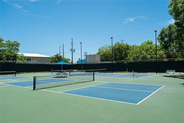 view of sport court with basketball hoop