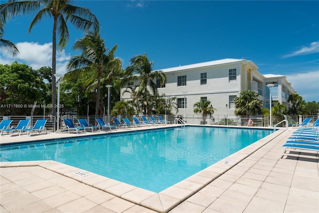 view of swimming pool featuring a patio area