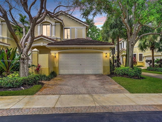 view of front of home with a garage