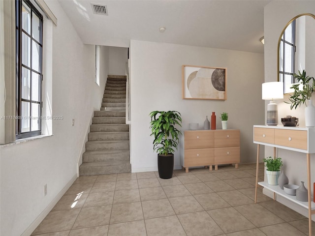 staircase featuring tile patterned flooring