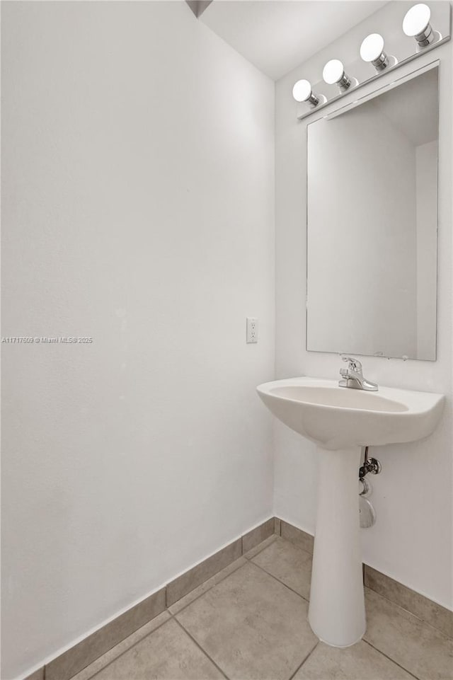 bathroom with tile patterned flooring