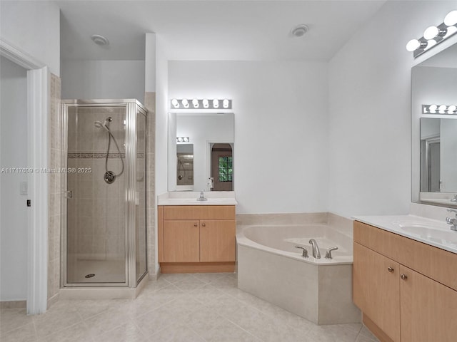 bathroom featuring vanity, tile patterned floors, and plus walk in shower