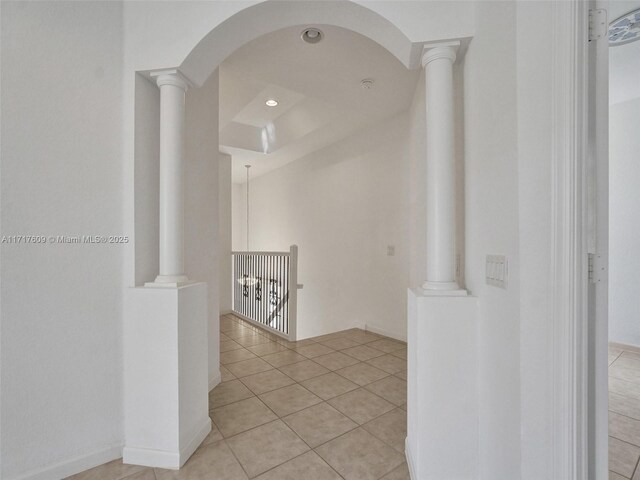 hallway with light tile patterned floors