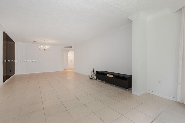 unfurnished room featuring a textured ceiling, an inviting chandelier, crown molding, and light tile patterned flooring