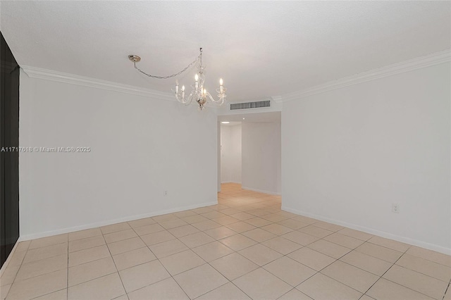 tiled spare room featuring a notable chandelier and ornamental molding