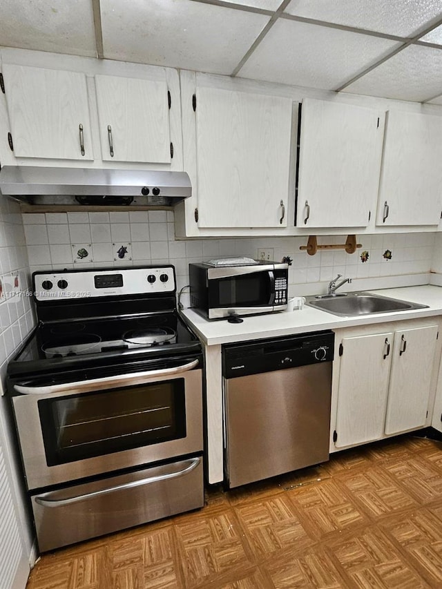 kitchen with white cabinets, stainless steel appliances, and sink