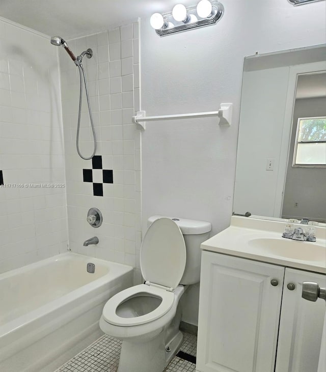 full bathroom with tile patterned floors, vanity, toilet, and tiled shower / bath