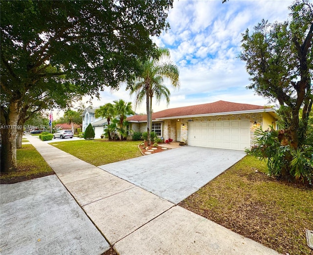 ranch-style home with a front yard and a garage