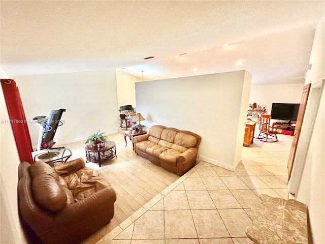 living room featuring light tile patterned flooring and lofted ceiling