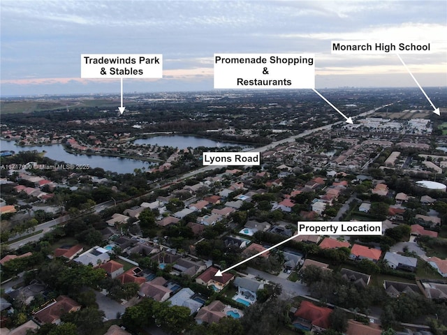 aerial view at dusk with a water view