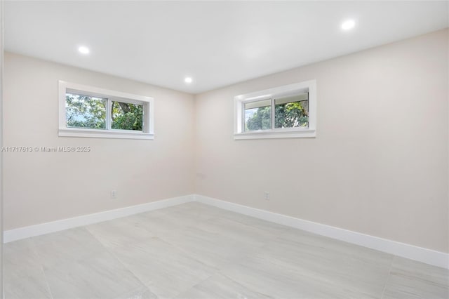 unfurnished room featuring plenty of natural light