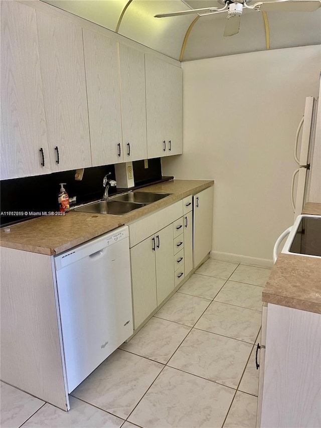 kitchen with ceiling fan, light tile patterned flooring, white appliances, and sink