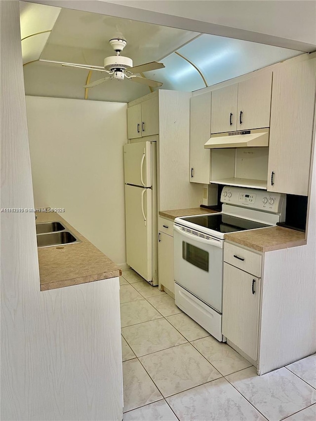 kitchen featuring white appliances, ceiling fan, sink, cream cabinetry, and light tile patterned flooring