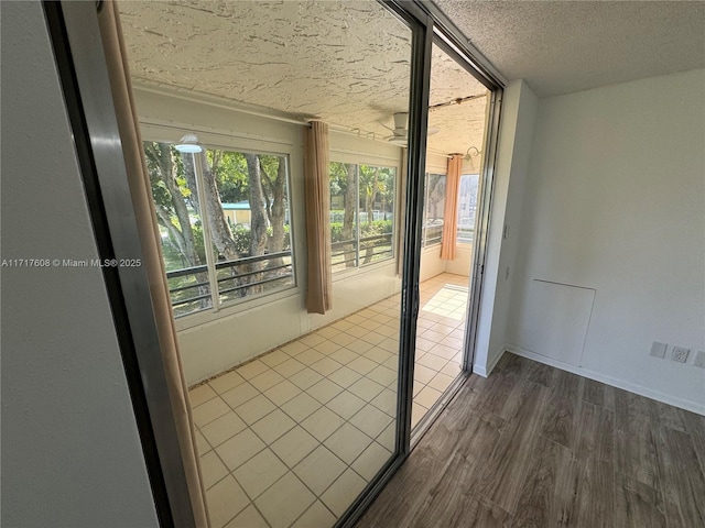 entryway featuring dark hardwood / wood-style flooring and a textured ceiling