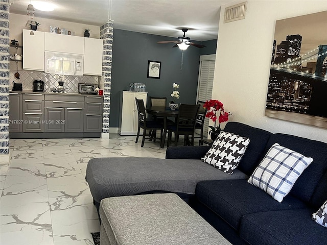 living room featuring ceiling fan