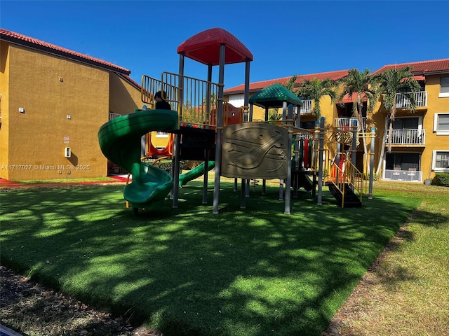 view of playground with a yard