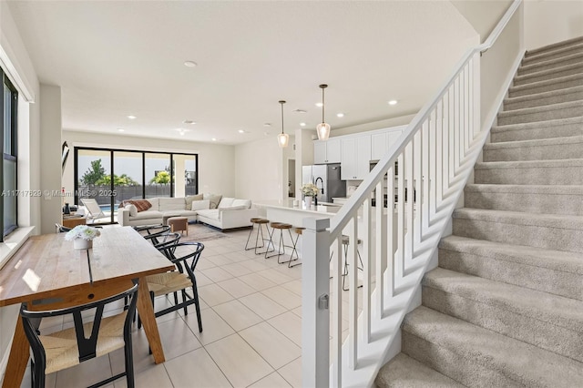 stairway featuring tile patterned floors