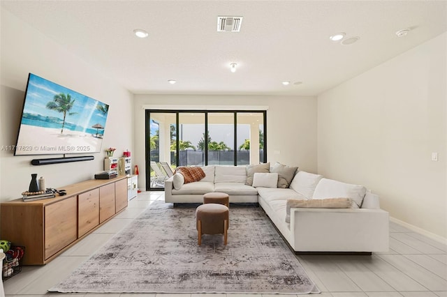 living room with light tile patterned flooring